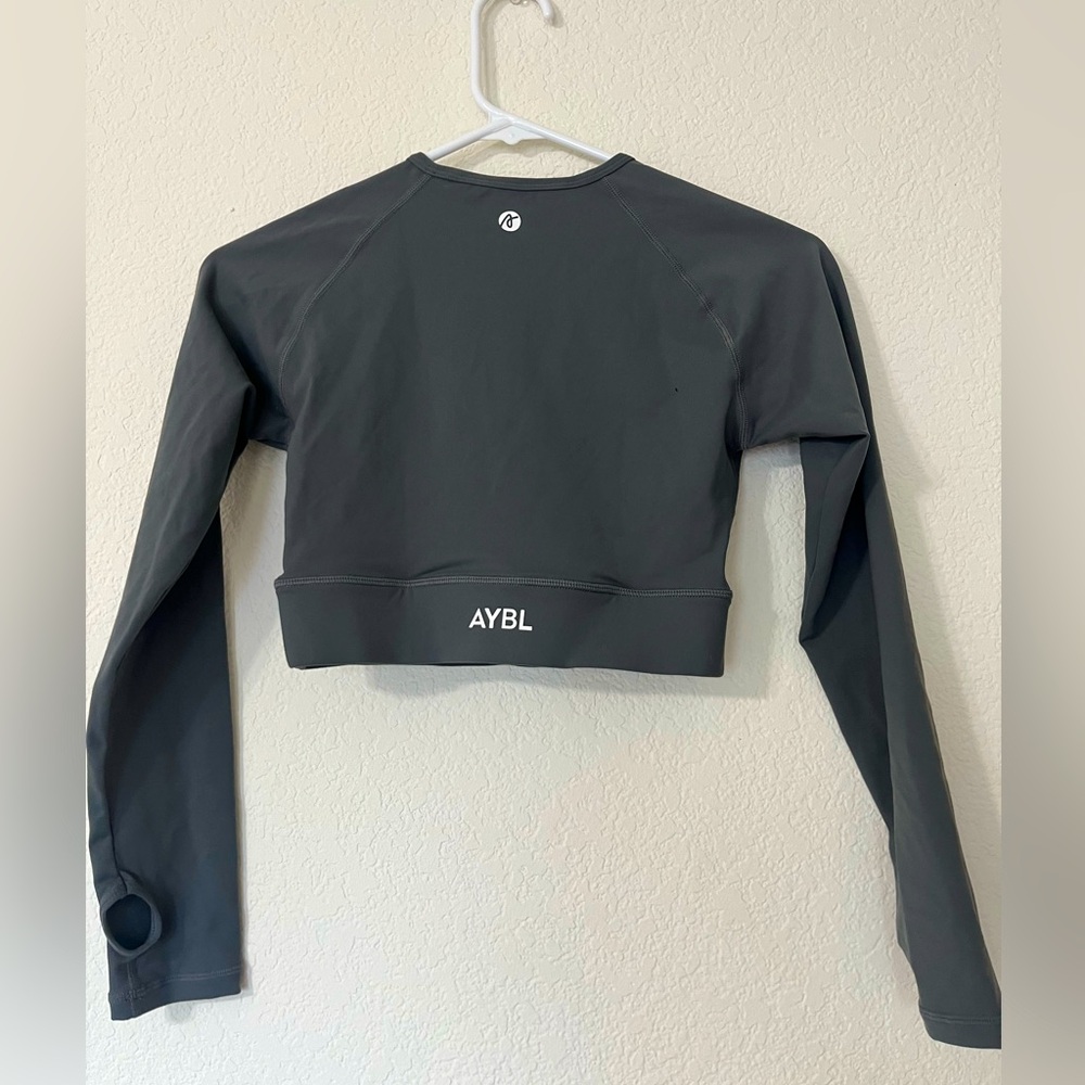 Earthy green long sleeve cropped AYBL workout top